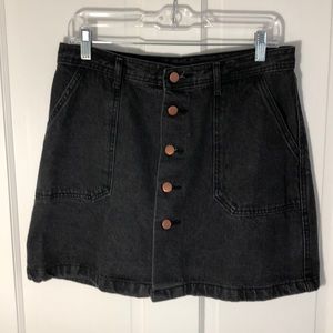 Black denim A-line button up pocket skirt.